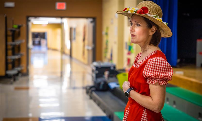 Teachers and students participate in a '20s catwalk presentation